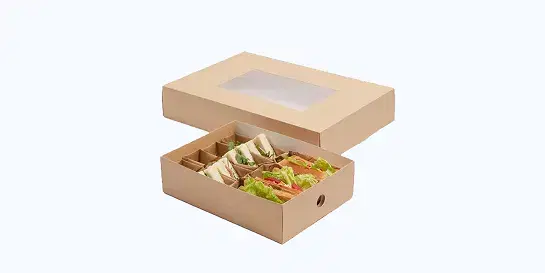 Open rectangular kraft cardboard box with transparent window lid and compartmented insert holding sandwiches and salad