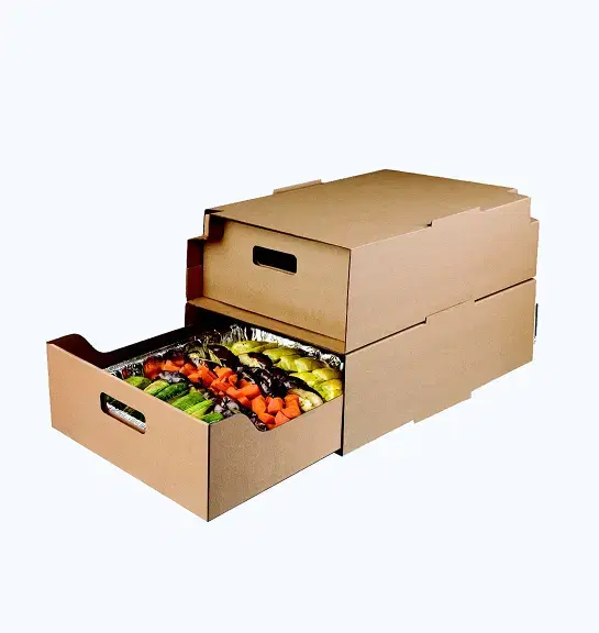 Stack of two rectangular kraft cardboard boxes with pull-out drawer containing cooked vegetables in aluminum foil-lined tray