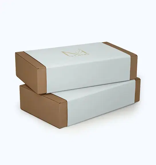 Two stacked rectangular shipping boxes with THE MERO logo