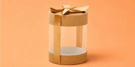Stack of flat rectangular light brown cardboard boxes
